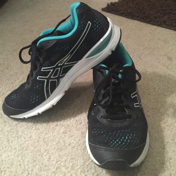 Black and turquoise ASIC tennis shoes