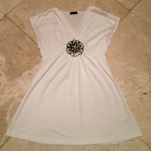 White top with floral detail