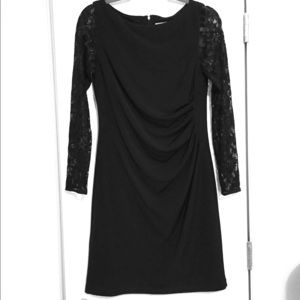 Short black dress with long lace sleeves