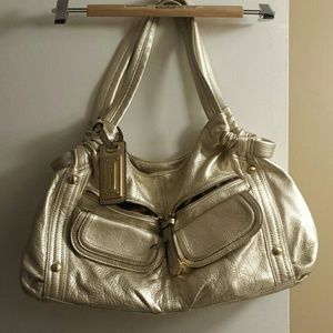 B. Makowsky gold metallic bag