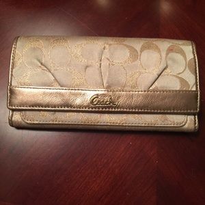 Gently used authentic gold fabric Coach wallet