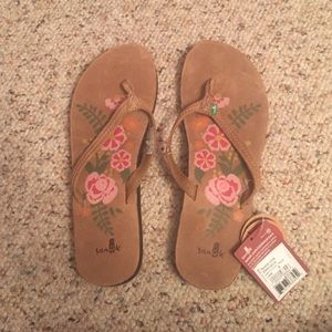 Unworn pair of sanuk floral sandals