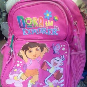 A light pink Dora backpack