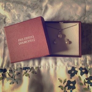 Helzburg Diamonds Pearl and diamond earrings.