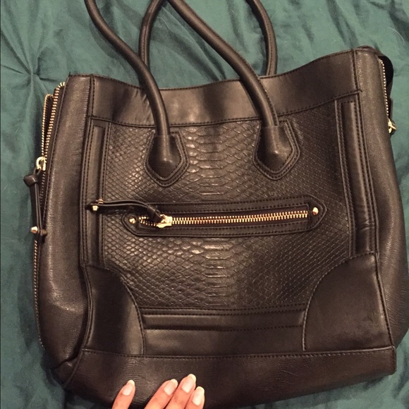 Black Aldo purse, with gold hard wear.