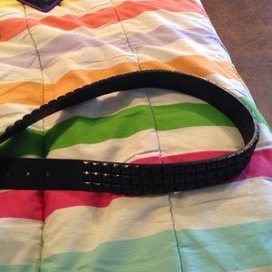 Black medium belt. Never been used.