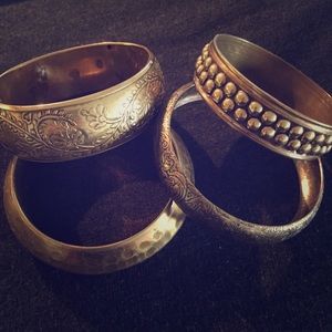Four gold colored bangles!