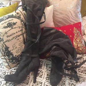Grey suede and leather thigh high boots.