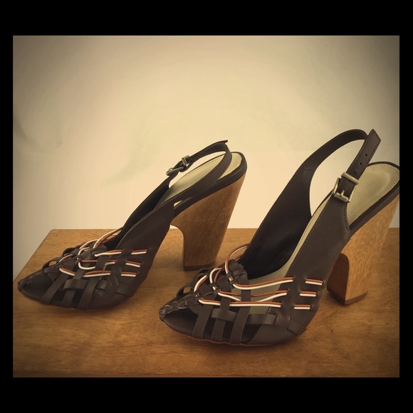 Wooden and leather sandals with wooden heels.