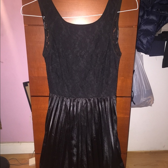 Black dress with open back, lace and pleat detail