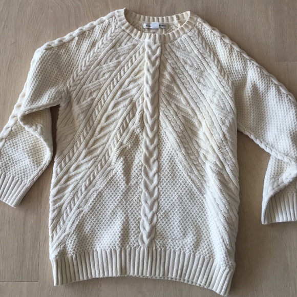 Cable knit sweater.