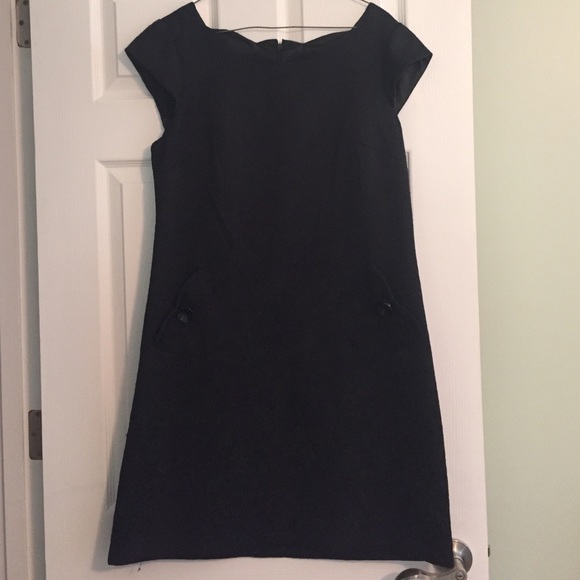 A symmetrical black dress