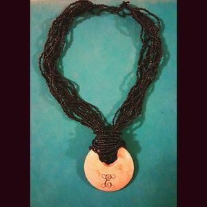 Necklace with engraved "E"