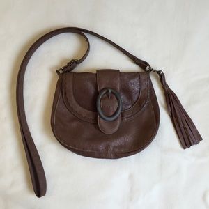 Crossbody bag with cabochon buckle in brown