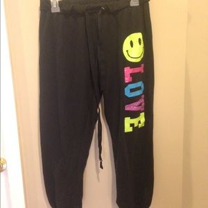 NWOT Black scrunch pants with neon lettering