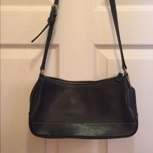 Black leather Authentic Coach handbag.