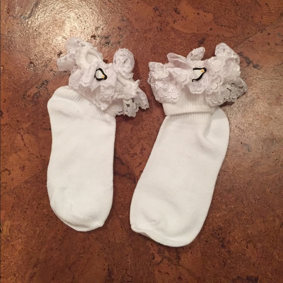 White children's socks with lace and penguin decor