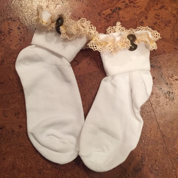 White children's socks with brown buttons