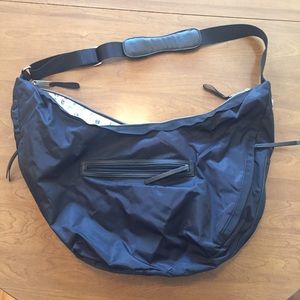 lululemon black messenger bag. revolution hobo.