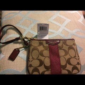Coach wristlet. Tan and merlot.
