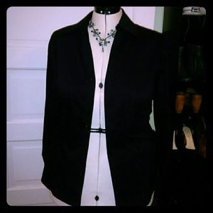 Sleek black button down shirt.