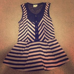 Tan and black peplum top