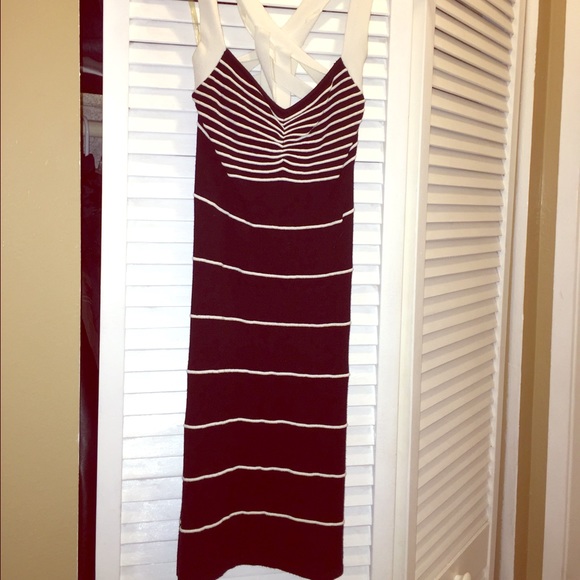 Black bandage dress with white stripes.