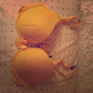 Yellow bra never worn with stars