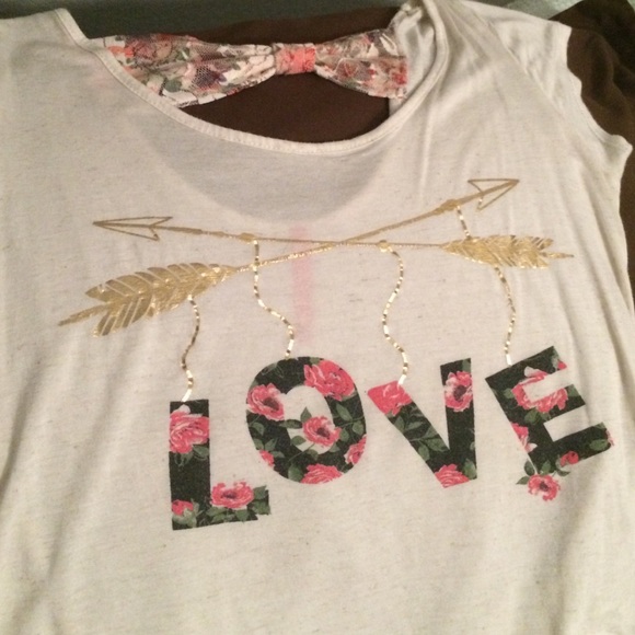 Cream top with floral letters and gold arrows