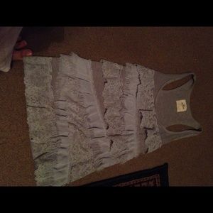 I'm selling a small grey ruffled tank top
