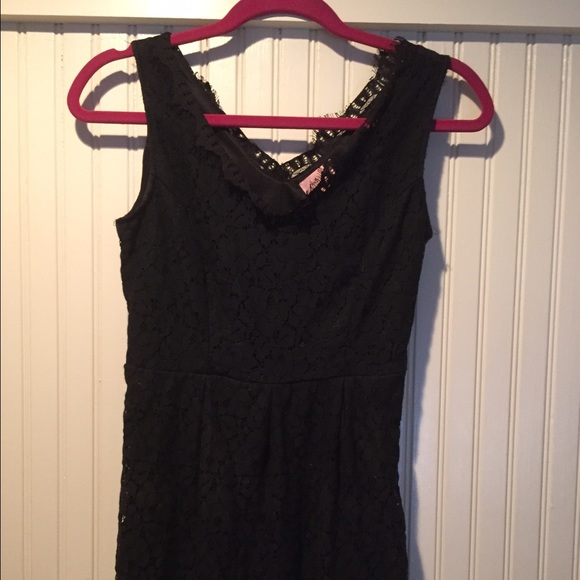 A black lace dress, knee length