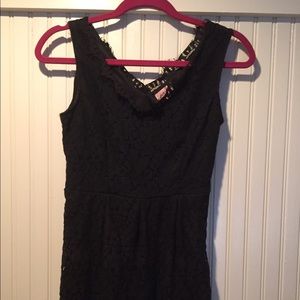 A black lace dress, knee length