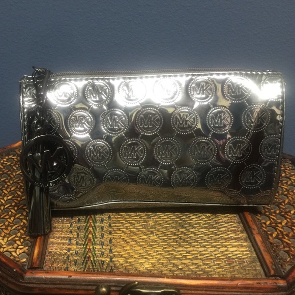 Michael Kors metallic zippered cosmetic case!