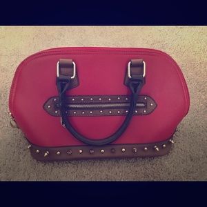 Red satchel type purse with brown trimmings