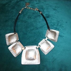 Graduating in size square statement necklace.