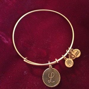 Expandable Alex and Ani gold tone bracelet