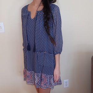 Boho, peasant dress with tassels.