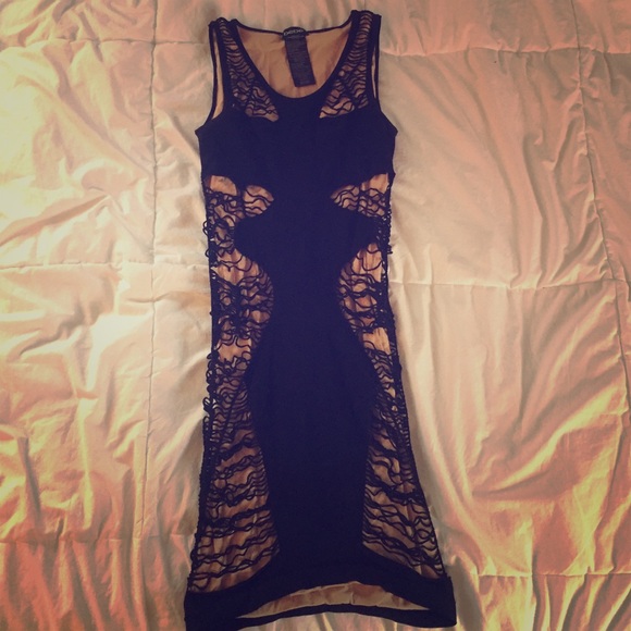 Black and nude bodycon Bebe dress.