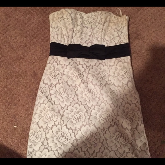 A white lace dress with black bow