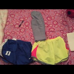 2 pairs of Nike shorts and Grey Nike capris