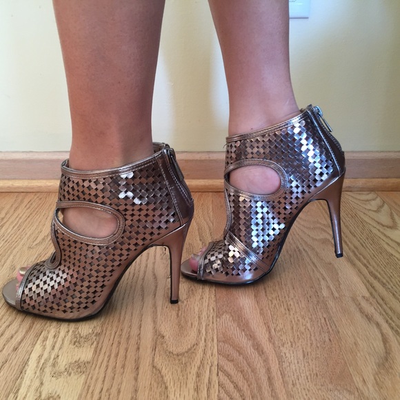 Never worn, gold/silver cutout heels.