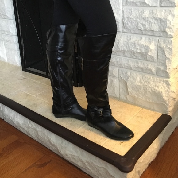 Tall black wedge boots