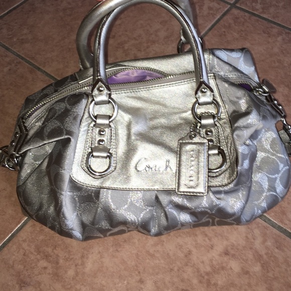 SOLD gently used authentic silver coach