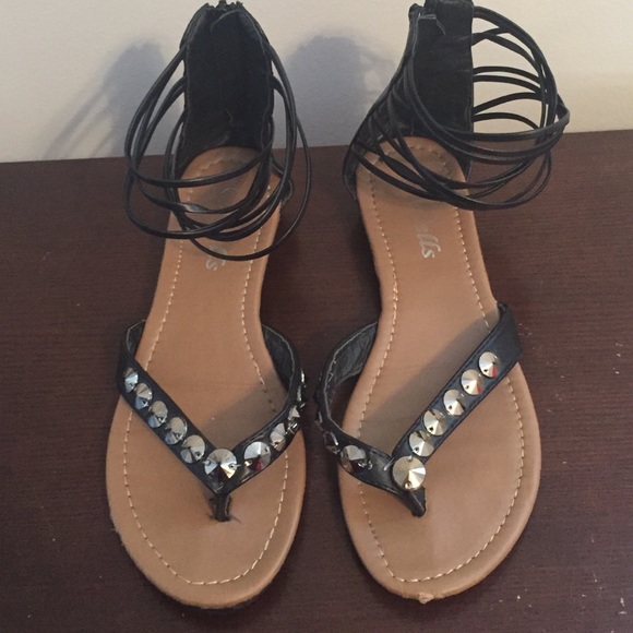 Black sandals zip up the back