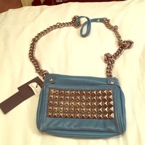 Small team and silver studded bag