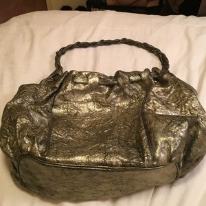 Beautiful metal gold and black Botkier