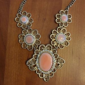 Gorgeous peach colored necklace.