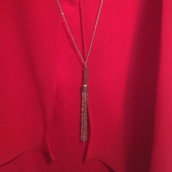 I am selling a red sleeveless blouse - Picture 2 of 3