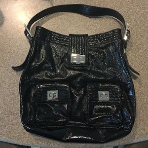 Black Kooba patent leather purse.