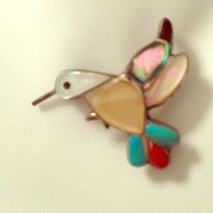 Turquoise and mother of pearl hummingbird brooch.